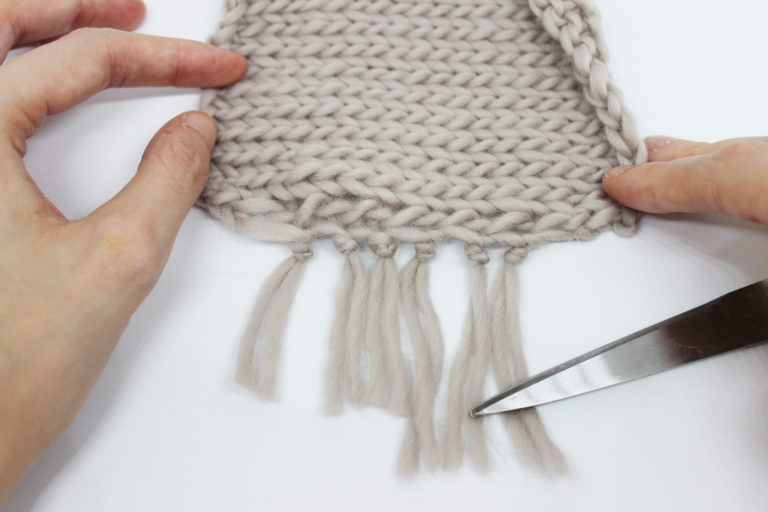 Tie them as close to the knitted fabric aspossible.